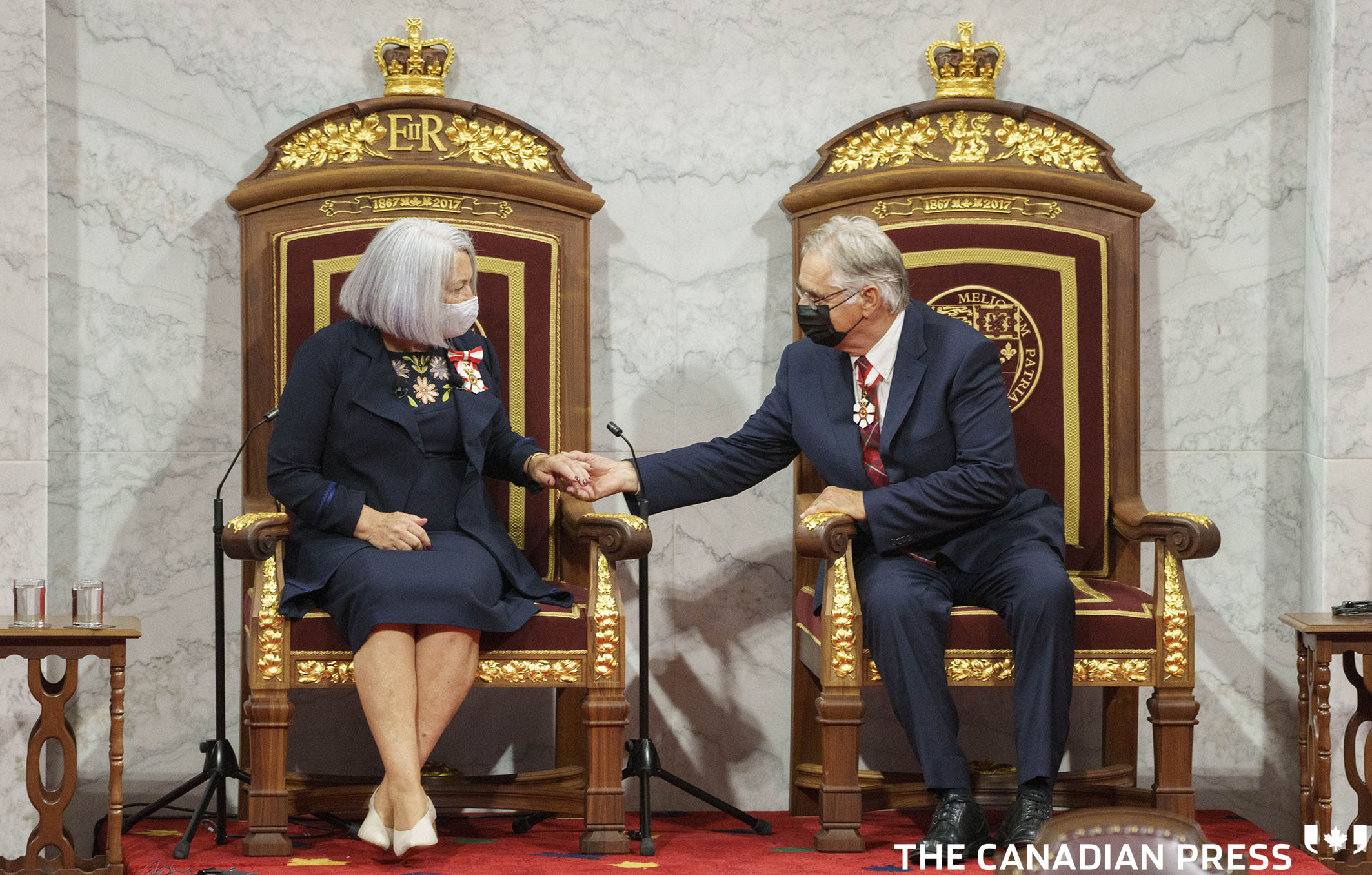 Mary Simon is congratulated by her husband Whit Fraser after being sworn in as the 30th governor general of Canada on during a ceremony in the Senate in Ottawa on Monday, July 26, 2021. THE CANADIAN PRESS/Paul Chiasson