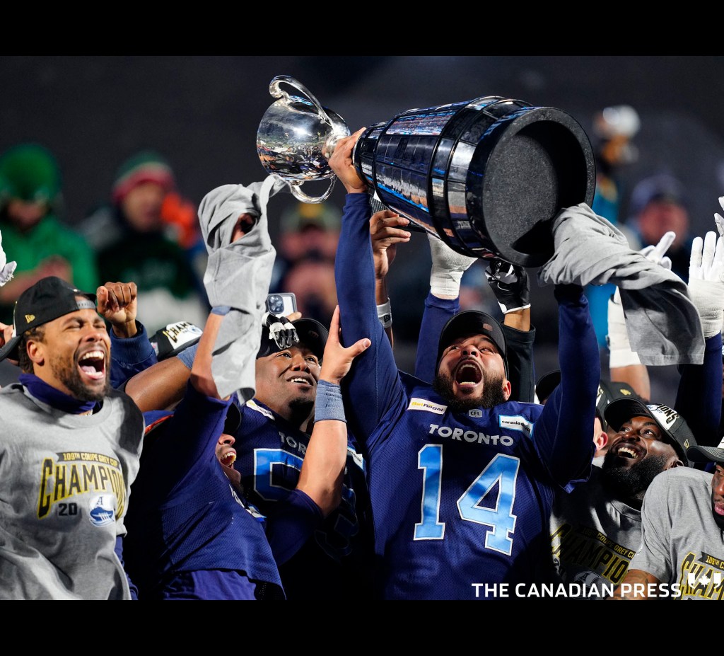 Toronto Argonauts kicker Boris Bede (14) hoists the trophy and celebrates with teammates after beating the Winnipeg Blue Bombers in the 109th Grey Cup at Mosaic Stadium in Regina, Sunday, Nov. 20, 2022. THE CANADIAN PRESS/Paul Chiasson